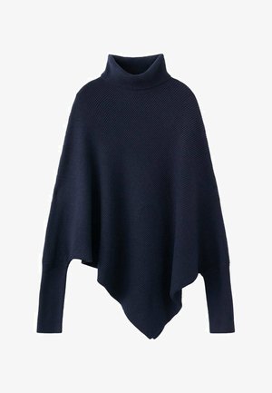 Pletena mornarsko plava pončo s visokim ovratnikom, karakteristična po opuštenom kroju i teksturiranom rebrastom uzorku. Rub je asimetričan i pada u naborima.