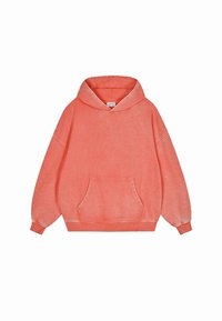 Koraal oversized hoodie gemaakt van zachte stof. Bevat een voorke pocket, trekkoord kap en ribgebreide manchetten. Lichtjes gestructureerde afwerking.