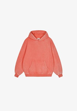 Korallenfarbener Oversized-Hoodie aus weichem Stoff. Mit einer Fronttasche, Kapuze mit Kordelzug und gerippten Bündchen. Leicht strukturierte Oberfläche.