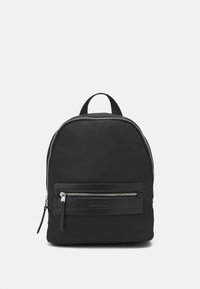 Black nylon backpack with a rounded shape, featuring a front zip pocket, silver hardware, a top handle, and a textured design.