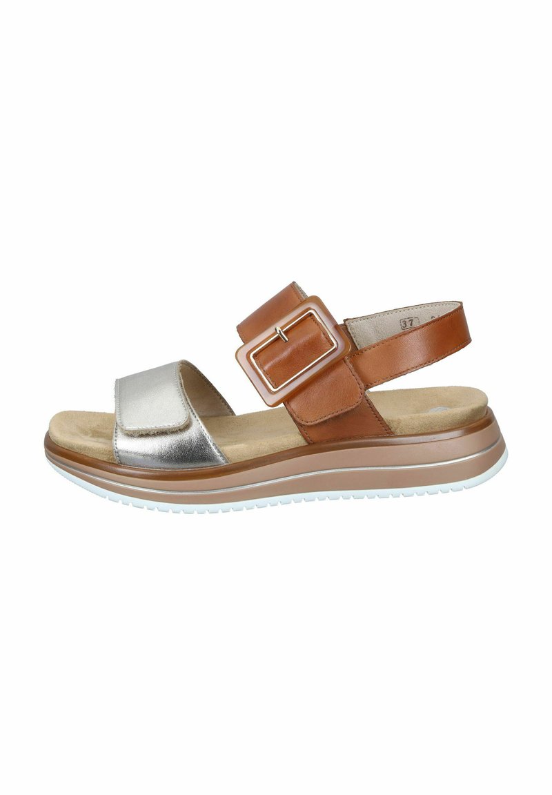 Brown and silver sandal featuring a wide strap with a large buckle, cushioned footbed, and textured rubber sole for grip.