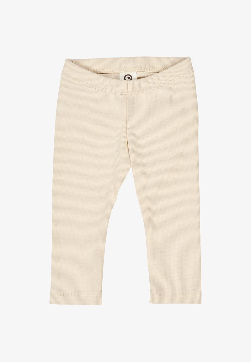 Wręczony beżowy leggingi prążkowane z elastycznym pasem i dopasowanym krojem, bez widocznych wzorów lub detali metalowych.