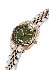 Złoto- i srebrnotonowy zegarek z zieloną tarczą, rzymskimi cyframi, diamentowymi akcentami i wyświetlaczem daty. Bransoletka linkowa o wypolerowanej powierzchni.