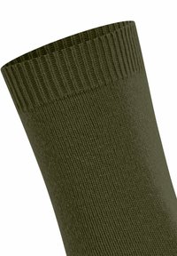 Tessuto a maglia a coste di colore verde oliva, che mostra un primo piano del polsino della calza con bordo elastico per una vestibilità sicura.