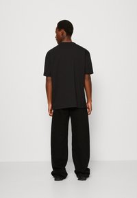 Calvin Klein Jeans MONOLOGO TEE UNISEX - T-shirt z nadrukiem