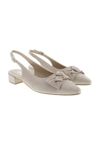 Beige suede slingback shoes with a pointed toe, decorative bow on the front, and a low block heel with a metallic accent.