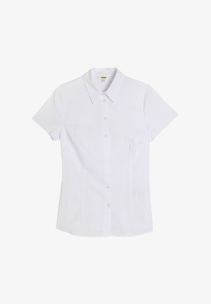 Camicia bianca a maniche corte con colletto rigido, realizzata in tessuto liscio. Presenta una forma aderente e sei bottoni trasparenti lungo il davanti.