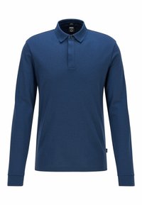 Mörkblå långärmad polo skjorta i texturerat tyg, med krage och knappslå framtill med två knappar.