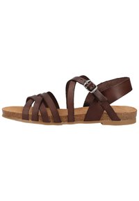 Sandali in pelle marrone con più cinturini incrociati, un cinturino posteriore con fibbia in argento e una soletta in sughero testurizzata. Suola piatta in gomma.