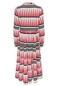 Robe à motifs floraux avec une base blanche ornée de détails rouges et noirs, manches longues, design à volants et taille cintrée.