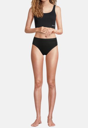 Schwarzes Baumwoll-Crop-Top und hochgeschnittene Unterwäsche; glatte Textur, minimales Design und keine sichtbaren Muster oder Grafiken.