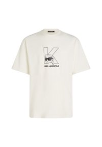 Biela bavlnená tričko s čiernym grafickým potlačou stylizovanej tváre s okuliarmi a veľkým "K" vpredu. Krátke rukávy, voľný strih.