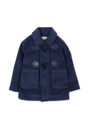 Marineblauwe wollen toggle-jas met twee voorzakken, een brede kraag en toggle-sluitingen met zwarte lederen afwerking op een witte achtergrond.