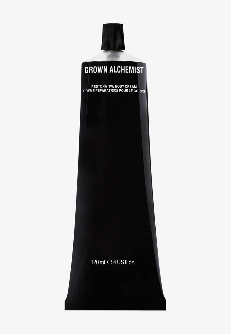 Czarny aluminiowy tubka regenerującego kremu do ciała, z białym napisem. Pojemność: 120 ml lub 4 untce amerykańskie. Można ściskać, z plastikową zakrętką.