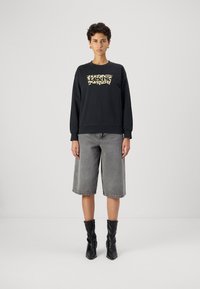 Levi's® GRAPHIC STANDARD CREW - Mikina - black