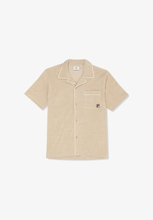 Beige lyhythihainen napillinen paita, jossa valkoinen reunustus ja rintatasku, jossa pieni punainen ja sininen logoliuska.