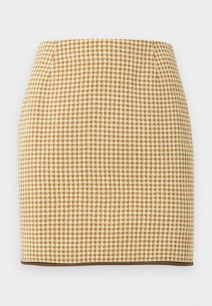 Fustă conică în model de căprior bej și maro, cu o siluetă cambrată și bordură maro închis la tiv.