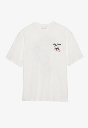 White cotton t-shirt featuring short sleeves and a round neck, with embroidered floral design in pink and black on the left chest.
