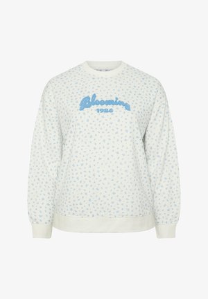 Hvid langærmet sweatshirt med lille lyseblåt blomstermønster og blå tekst "Blooming 1986" hen over brystet.
