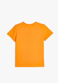 Kortærmet t-shirt i lys orange bomuldsstof, med rund hals og lige snit, uden grafik og med pæne sømme.