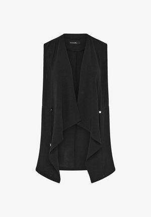 Zwart mouwloos vest met open voorkant, asymmetrische gedrapeerde zoom en subtiele textuur, ontworpen om te combineren in lagen.