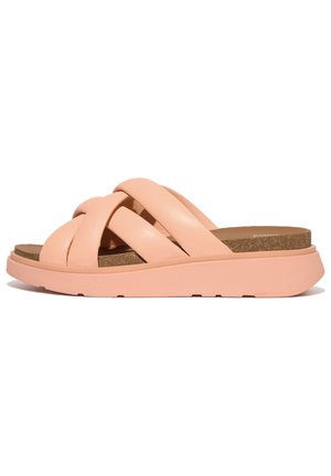 Pink leather slide sandals with a braided strap design, cork footbed, and light rubber sole, featuring a wide, open toe area.