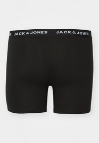 Schwarze Boxershorts aus weichem Stoff mit einer engen Passform. Sie verfügen über einen breiten elastischen Bund mit dem weißen Logo "JACK & JONES".