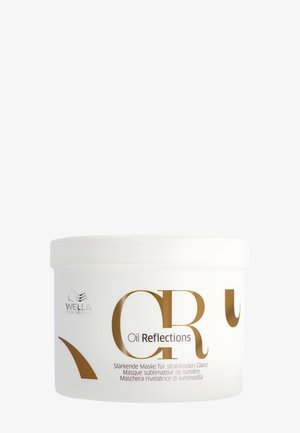 Behälter der Wella Professionals Oil Reflections Haarmaske mit goldener und schwarzer Schrift auf weißem Hintergrund.