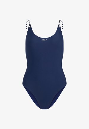 Tumesinine üheosaline ujumistrikoo reguleeritavate valgete ja tumesiniste triibuliste õlarihmadega ning väikese logoga ees. Sile, veniv materjal.