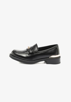 Black leather loafer with low stacked heel and gold decorative buckle on penny strap, shown in side profile on white background.