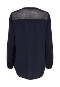 Blusa a maniche lunghe blu navy con schiena a rete a quadri trasparente, orlo arrotondato e polsini con bottoni. Tessuto morbido con una vestibilità rilassata.
