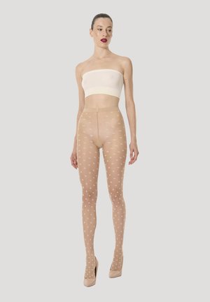 Nude mønstrede strømpebukser med et blomstermønster i hvid, med en tætsiddende pasform og en glat, gennemsigtig tekstur. Stylet med en stropløs top.