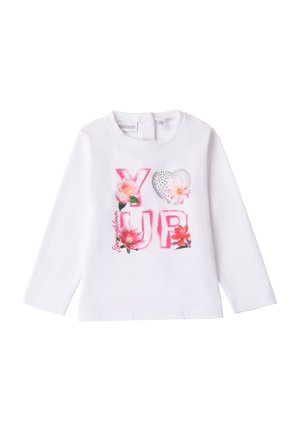 Chemise blanche à manches longues avec "YOU" et "UP" en rose avec des motifs floraux et un cœur argenté. Matière en coton doux, design col rond.