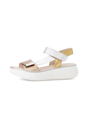 Metallic platform sandals with gold, silver, and white straps. Features a thick white sole and a smooth, glossy finish. Designed for support.