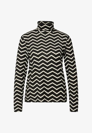 Maglia a collo alto bianca e nera con motivo a zigzag a chevron. Realizzata in tessuto dalla texture morbida e con maniche lunghe.