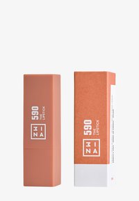 Matte peach lipstick tube with white text, square shape, and a contrasting lighter box with brown accents and product details.
