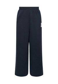 Marina blå mjukisbyxor i mjuk bomull, med resårmidja och breda ben, samt en liten logotyp på sidan.