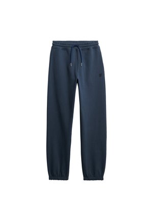 Marineblå joggingbukser med elastisk talje og manchetter, justerbar snøre og lille logo på venstre lår.