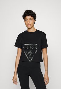 Guess - ADELE CROP  - T-shirts med print - jet black Miniatyrbilde 1