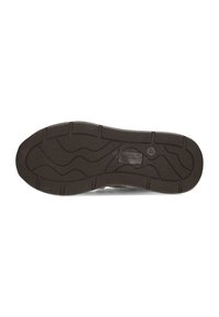 Suola di scarpa in gomma nera con un pattern testurizzato caratterizzato da linee ondulate e sezioni rialzate per una migliore aderenza. Punta arrotondata e costruzione robusta.