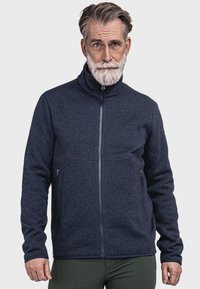 Marineblaue Fleecejacke mit hohem Kragen, durchgehendem Reißverschluss und Seitentaschen; verfügt über kontrastierende dunkelblaue Einsätze und ein strukturiertes Muster.