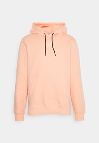 Hřejivá mikina v broskvové barvě vyrobená z měkké látky, s přední kapsou, kapucí se stahovacími šňůrami a malou logem na hrudi.