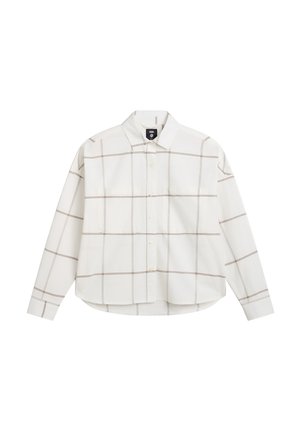 Camisa blanca de manga larga con un patrón de cuadros marrones, cuello abotonado y dos bolsillos en el pecho. Fabricada en suave algodón. Dobladillo curvado.