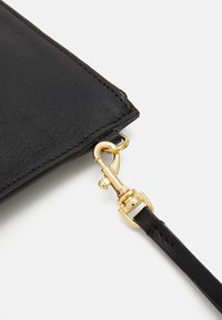 Fiorucci DRIP POUCH UNISEX - Delninukė - black