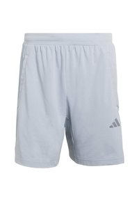 Light blue athletic shorts made of soft fabric, featuring an elastic waistband, side pockets, and a gray Adidas logo on the lower left leg.