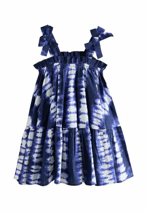 Maksi brez rokavov z mornarsko modrim in belim tie-dye vzorcem, elastičnim smukom na telesu in velikimi pentljami na naramnicah. Plaste ruffles na robu.
