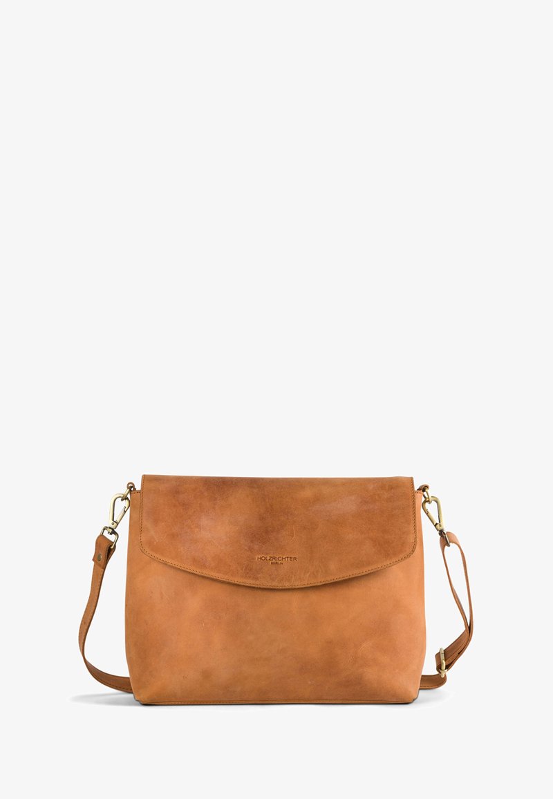 Tan leather shoulder bag with a flap closure, adjustable strap, and subtle embossed logo. Smooth texture with minimal hardware accents.