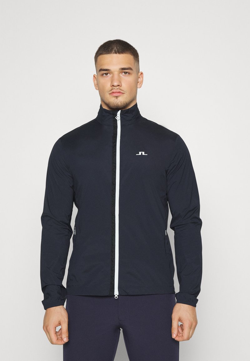 J.LINDEBERG Sports ASH LIGHT PACKABLE JACKET Hardshell jacket navy/dark blue Zalando.ie