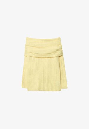 Jupe en tricot côtelé, jaune clair avec une taille repliée. Tissu doux, longueur moyenne avec une silhouette ajustée. La texture est lisse et confortable.