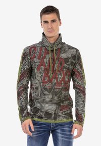 Grauer Kapuzenpullover mit roten und schwarzen grafischen Drucken, die Schädel- und Krondesigns zeigen. Texturiertes, leichtes Material mit Zugbändern.